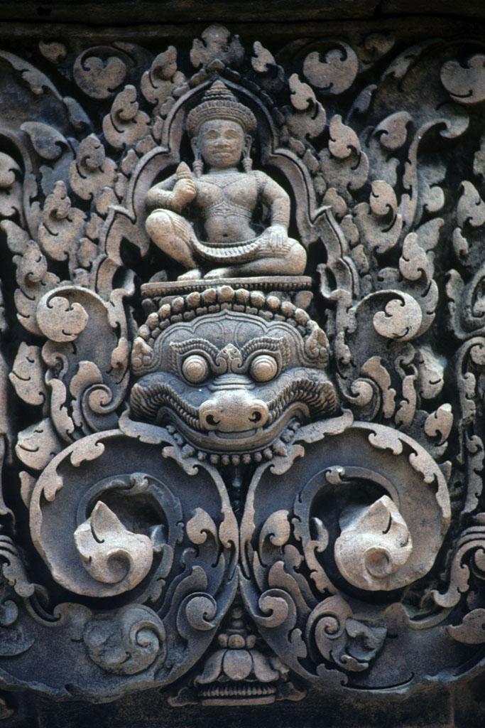 <img typeof="foaf:Image" src="http://statelibrarync.org/learnnc/sites/default/files/images/vietnam_206.jpg" width="683" height="1024" alt="Guardian deity above monster on low relief carving at Banteay Srei Temple" title="Guardian deity above monster on low relief carving at Banteay Srei Temple" />