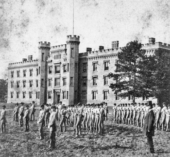 Students in front of the brick castlelike school building of Hillsborough Academy, ca. 1870s. North Carolina Collection, University of North Carolina at Chapel Hill Library.